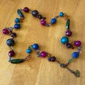 Costume jewelry.  Long necklace with colored beads.
